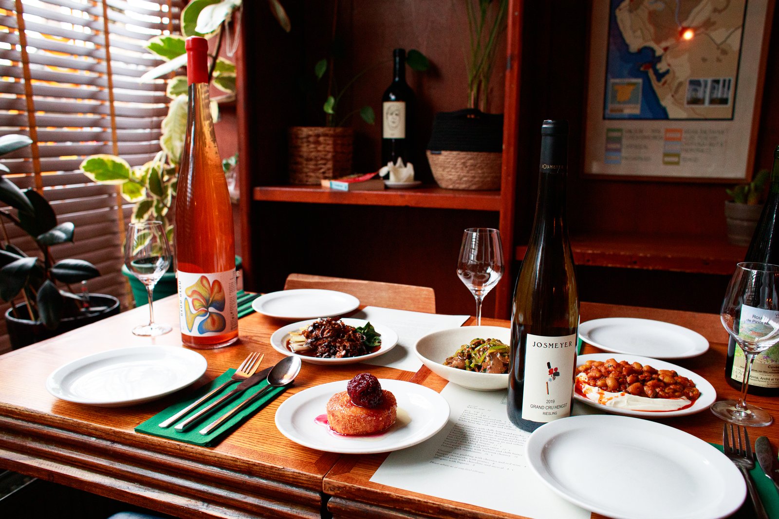 Wine and seasonal vegetarian dishes on the table at Sylvan