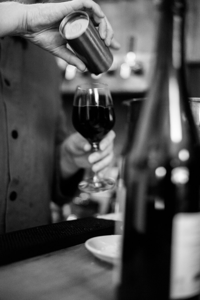 Pouring a glass of wine at La Cave